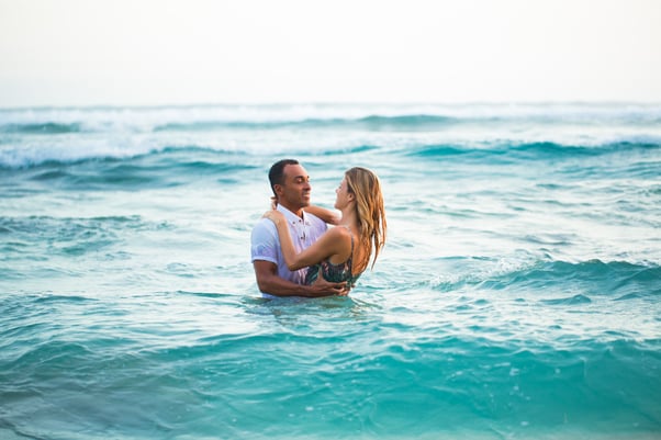 loving-couple-standing-water-hugging